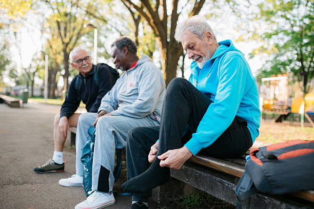 istock Senior men friends preparing for exercise in park 2242836799
