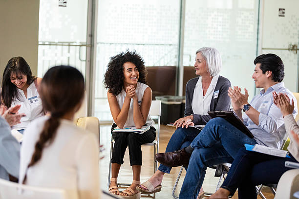 istock Diverse group of people in a circle sharing ideas and experiences in a comfortable setting. 2242840150