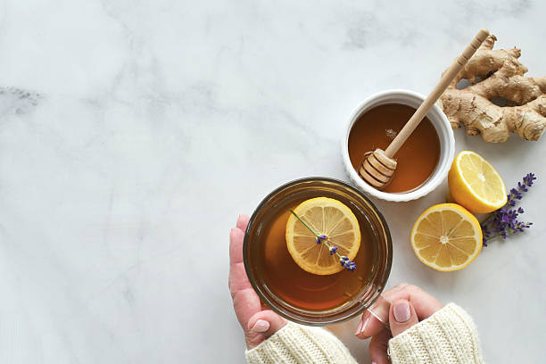 istock Lemon ginger tea with honey and lavender 2242842196
