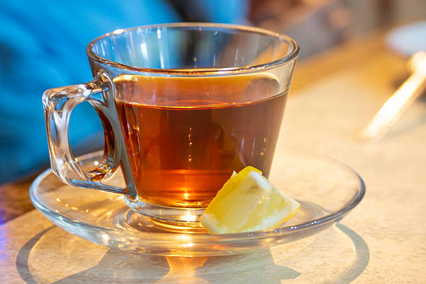 istock Hot turkish tea drinks with lemon in a mug or transparent glass on a white background 2242854451