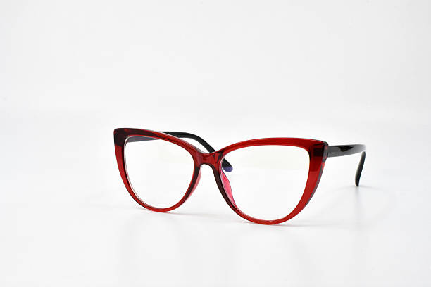 istock Pair of cat eye shape glasses with a red frame isolated on white 2242857440