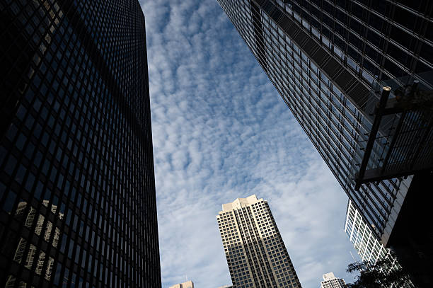istock skyscrapers view form below, with blue sky background 2242862503
