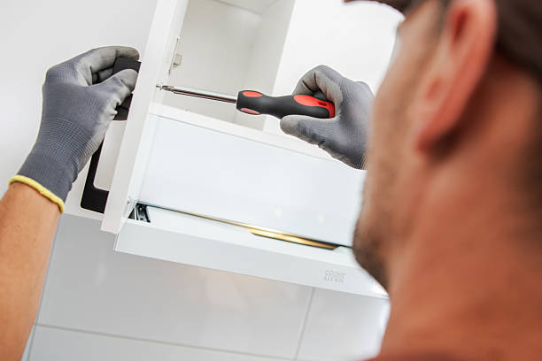 istock Home Improvement Project Involving Cabinet Installation With a Screwdriver 2242864199