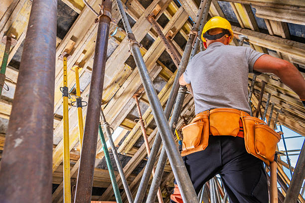 istock Construction Worker Building Scaffolding in a High-Rise Site During the Day 2242864452