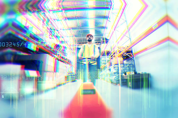 A logistics worker in a safety vest rides a push cart through a modern warehouse, transporting boxes amidst organized shelves and inventory.