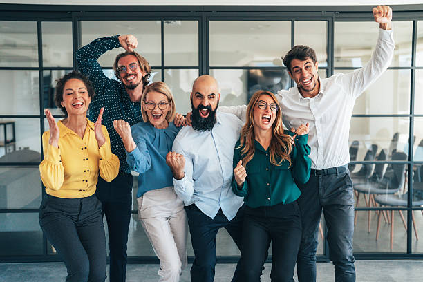 istock Business team celabrating after achieving goals 2242867937