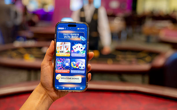 istock Gambler playing games using a mobile app on his cell phone 2242868724