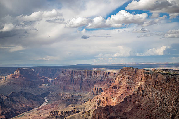 istock Wide View of Grand Canyon Layers with Dramatic Clouds and Sun 2242870110