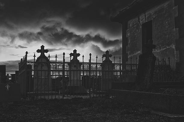 Creepy dark and spooky cemetery at night.