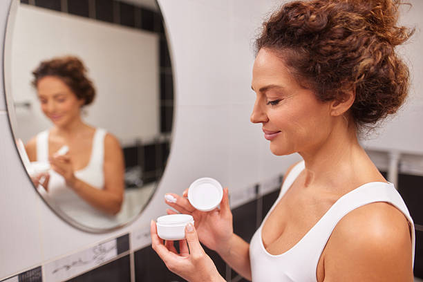 istock Woman applying anti-aging cream for skincare routine 2242873838