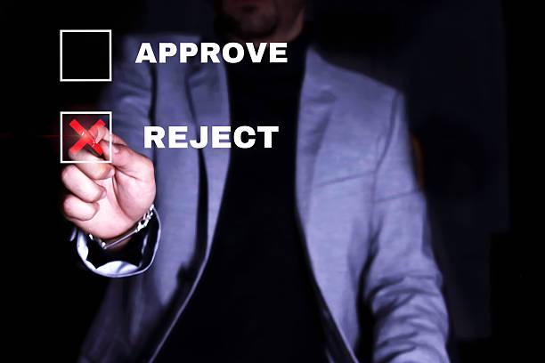istock Businessman rejecting a proposal by putting a red cross 2242874201