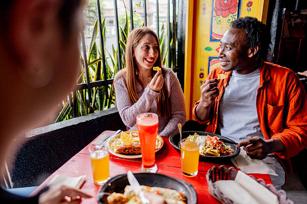 istock Friends sharing lunch at vibrant restaurant 2242875582