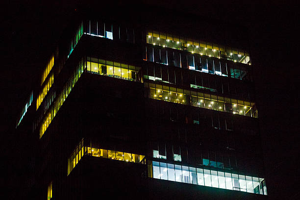 Modern office buildings with lights in rooms in Bangkok