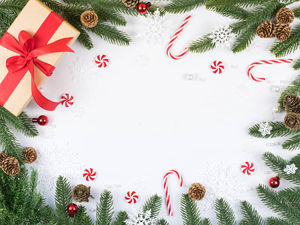 istock Festive gift box in top corner with seasonal decorations, candy canes and copy space 2242878390