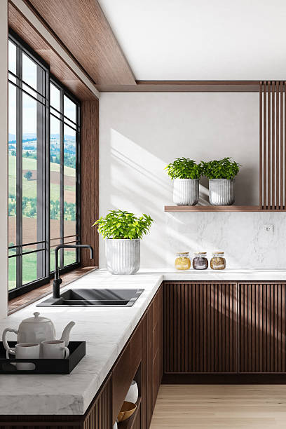 istock Luxury Dark Oak Kitchen with Marble Surfaces and Natural Light 2242885697