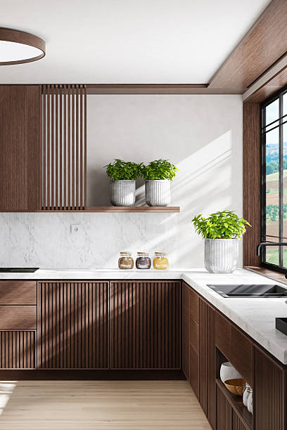 istock Luxury Dark Oak Kitchen with Marble Surfaces and Natural Light 2242885741