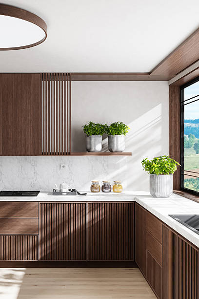 istock Luxury Dark Oak Kitchen with Marble Surfaces and Natural Light 2242885757