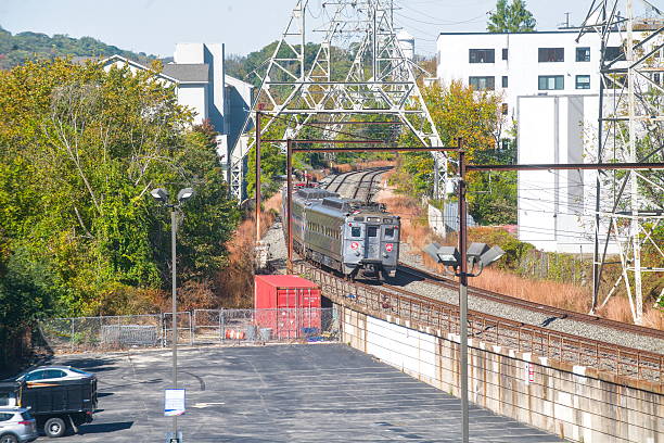 Two car set of Silverliner IVs on the Norristown line approaching Manayunk train station on a warm fall day in October of 2025 with heritage unit 276 leading.