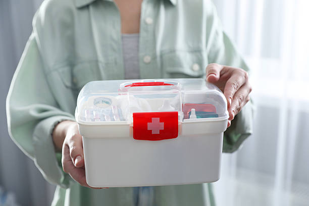 istock Woman holding first aid kit indoors, closeup 2242890861