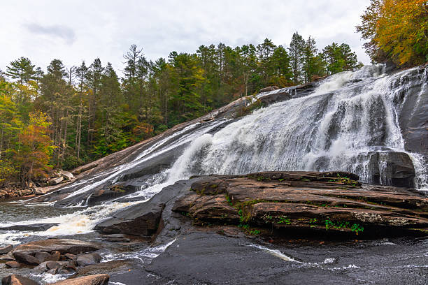 High Falls in DuPont State Forest is one of the most beautiful waterfalls in the area.  Watch and feel it at the bottom of the waterfall makes an unique experience.