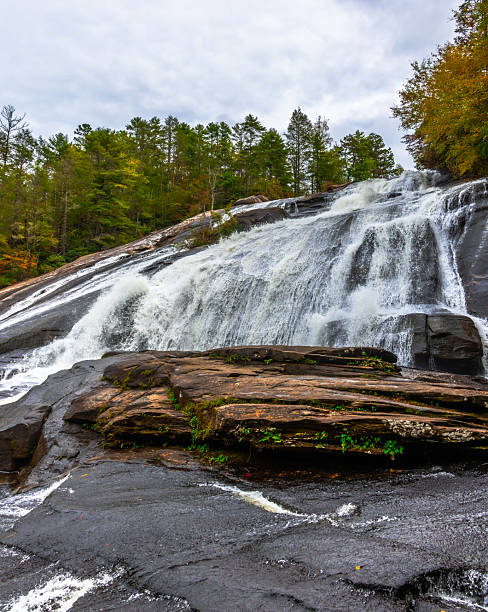 High Falls in DuPont State Forest is one of the most beautiful waterfalls in the area.  Watch and feel it at the bottom of the waterfall makes an unique experience.