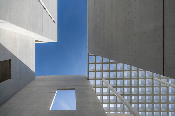 istock Looking up at the modern minimalist urban architecture with hollowed out ceilings 2242900872