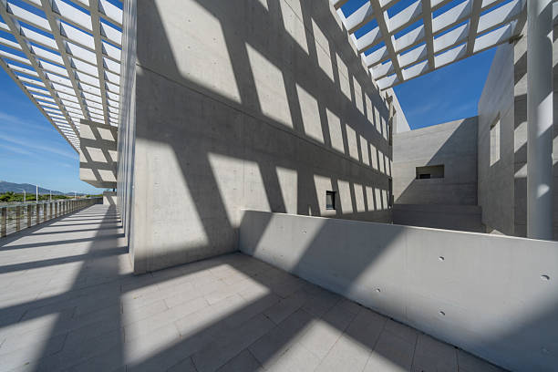 Sunlight refracts through the ceiling onto the simple and rough cement building.The building is the Pingtan International Performing Arts Center in Fujian Province, which is an outdoor public building,