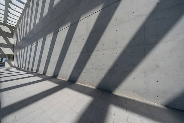 Sunlight refracts through the ceiling onto the simple and rough cement building.The building is the Pingtan International Performing Arts Center in Fujian Province, which is an outdoor public building,