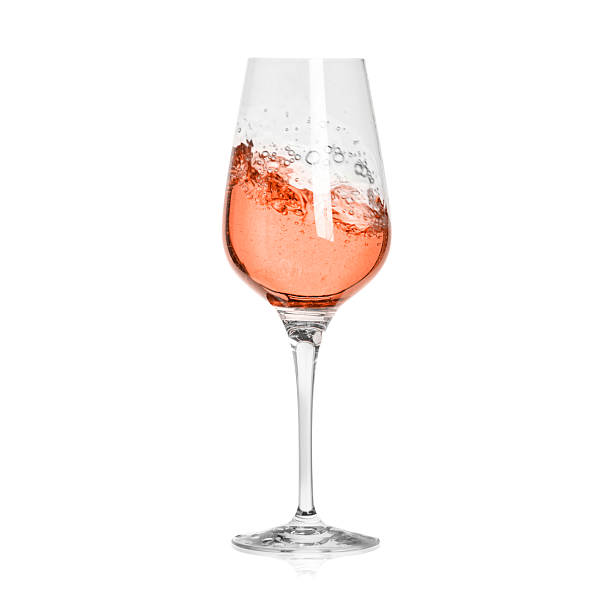 istock Rose wine splashing in glass on white background 2242903965