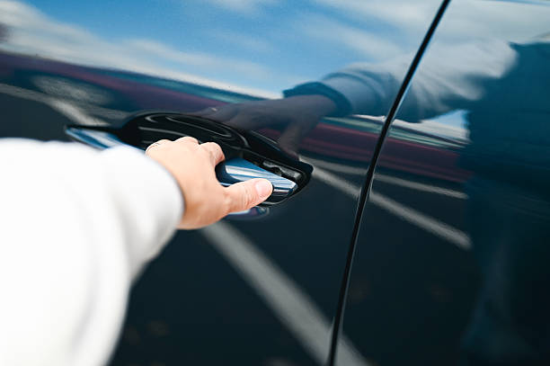 Hand opening car door, entering new vehicle