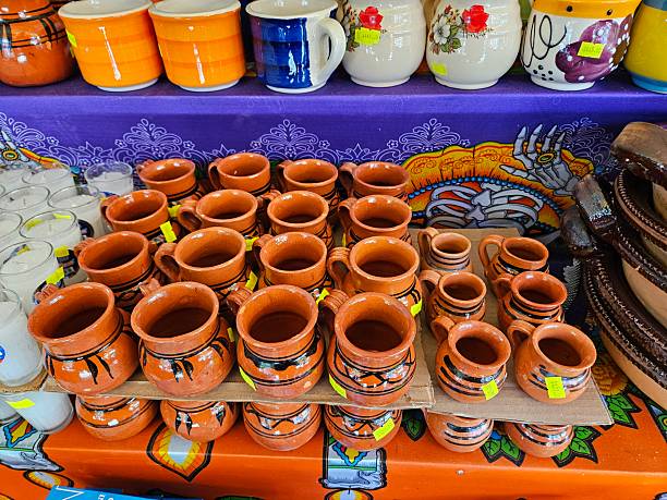 istock Ceramic pottery mugs on display at a market in Mexico. 2242905237