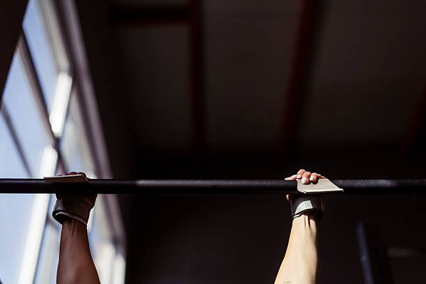 istock Athlete Gripping Pull-Up Bar During Gym Workout With Wrist Wraps 2242906810