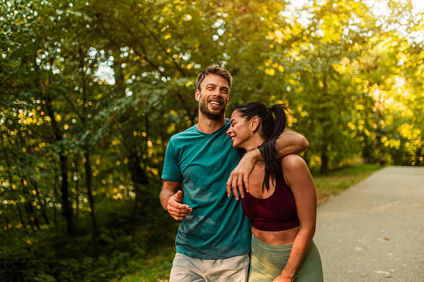 istock Cheerful athletic couple walking through the park. 2242908876