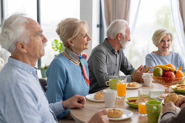 istock Happy Seniors Enjoying Refreshing Drinks and Good Company 2242911327