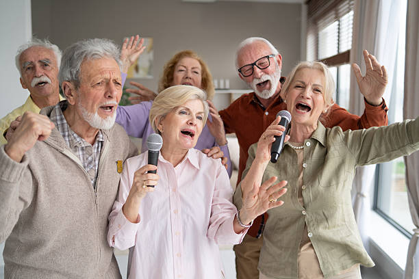 istock Seniors enthusiastically performing a musical number indoors 2242911574