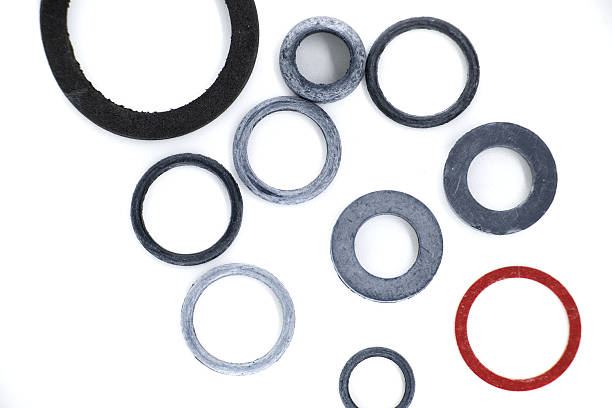 istock Assorted rubber rings and gaskets arranged on a white surface in a top-down, detailed view. 2242913424