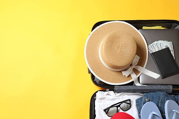 istock suitcase with things, travel background with space for text 2242916120