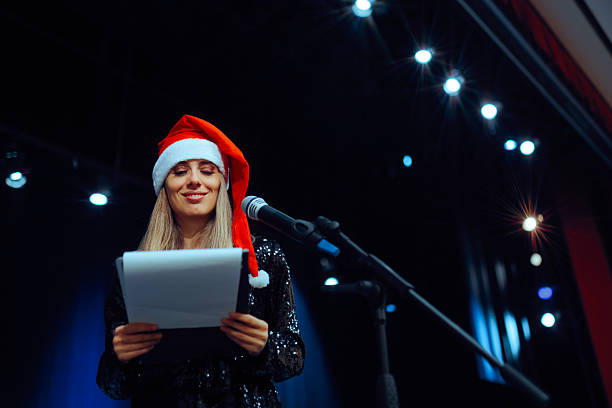 Female presenter making a speech on stage during Xmas event