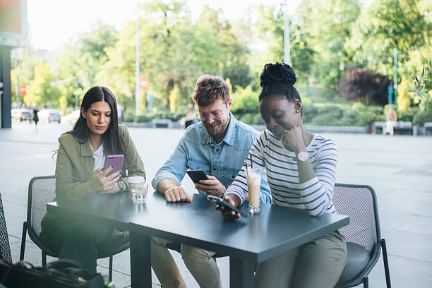 istock Friends browsing social media while sitting in coffee shop 2242925370