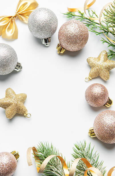 istock Christmas ornaments and pine branches framing blank space 2242926002