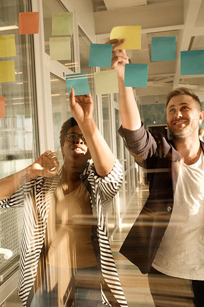 istock Colleagues Smiling when Brainstorming Ideas 2242927758