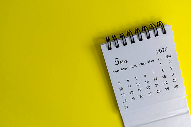 istock Hello, May 2026 desk calendar for planning on yellow background 2242928096