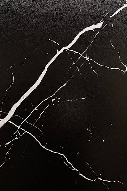Black marble texture with white veining gives an elegant look to any space in modern interior design