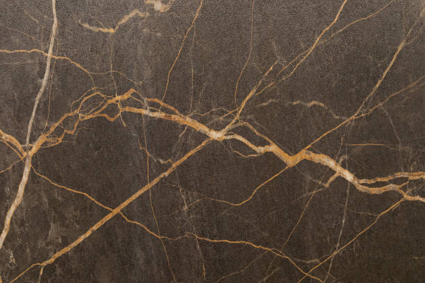 istock Black marble with gold veins creates an elegant backdrop for interior design or artistic projects 2242933189