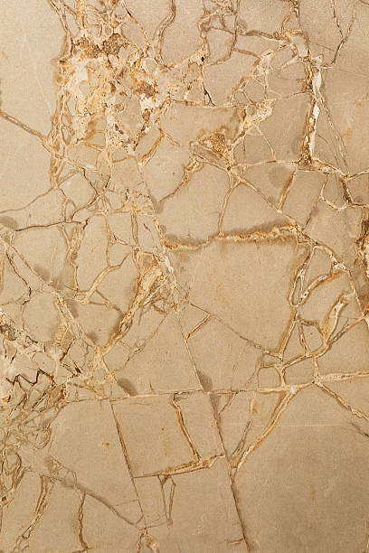 istock Elegant beige marble surface with intricate veining patterns found in modern interior design and architecture 2242933208