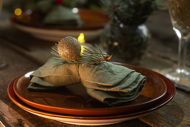 istock Plate with napkin decorated for Christmas dinner. Winter season table setting. 2242937740