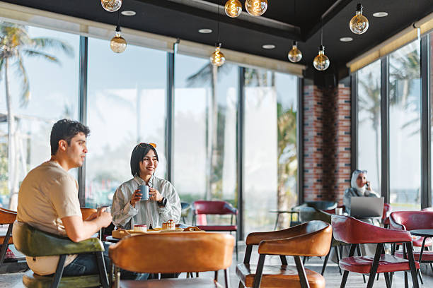 istock Joyful Diverse Young Couple Enjoying Dessert in Cafe 2242939042