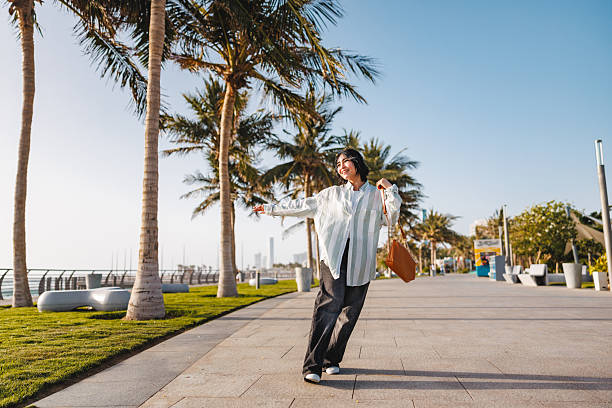 istock Delighted Tourist Enjoying Scenic Walk Along Seaside Path 2242939063