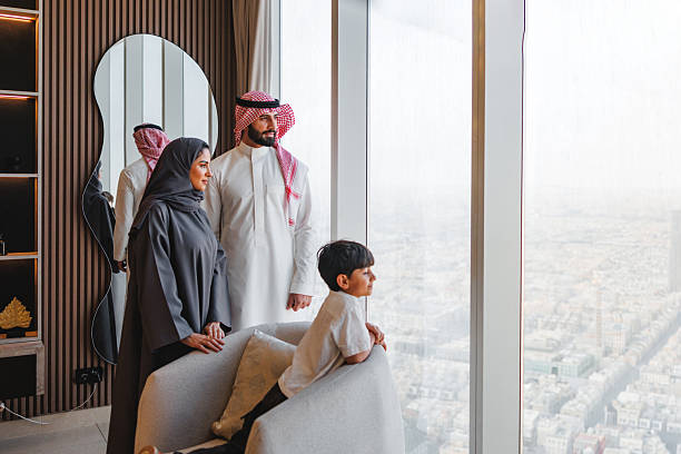 istock Middle Eastern Family Enjoying Panoramic Riyadh City View From Luxury Apartment 2242939738
