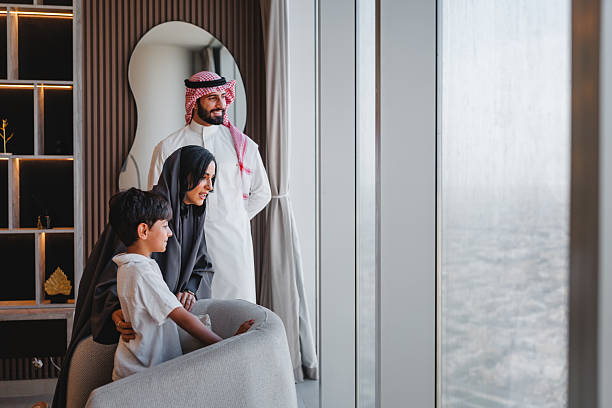 istock Middle Eastern Family Marveling at Riyadh's Skyline From Luxury Apartment 2242939797